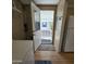Laundry room with exterior access and updated flooring at 11596 W Sierra Dawn Blvd # 28, Surprise, AZ 85378