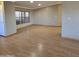 Open living room with hardwood floors and large windows at 11596 W Sierra Dawn Blvd # 28, Surprise, AZ 85378