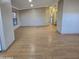 Spacious living room with laminate flooring, large windows, and ceiling fan at 11596 W Sierra Dawn Blvd # 28, Surprise, AZ 85378