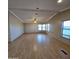 Spacious living room with laminate flooring, large windows, and ceiling fan at 11596 W Sierra Dawn Blvd # 28, Surprise, AZ 85378
