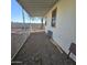 Covered patio with gravel flooring and a view of the backyard at 11596 W Sierra Dawn Blvd # 28, Surprise, AZ 85378