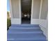 Steps leading to a relaxing screened-in porch with a swing at 11596 W Sierra Dawn Blvd # 28, Surprise, AZ 85378