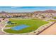 Aerial view of a community park with playground, basketball court, and open green space at 25227 N 131St Dr, Peoria, AZ 85383