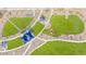 Bird's-eye view of a park with winding pathways, green spaces and shaded ramadas at 25227 N 131St Dr, Peoria, AZ 85383