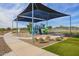 Modern playground with a shaded play area and colorful play equipment at 25227 N 131St Dr, Peoria, AZ 85383