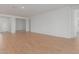 Open floor plan living room with tile floors and access to other rooms at 25227 N 131St Dr, Peoria, AZ 85383