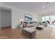 Bright and airy living room with modern furniture and tile floors at 25227 N 131St Dr, Peoria, AZ 85383