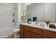 Clean bathroom with double vanity, bathtub, and updated fixtures at 25227 N 131St Dr, Peoria, AZ 85383