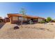 Brick ranch home with terracotta roof, desert landscaping, and a two-car garage at 11009 E Keats Ave, Mesa, AZ 85209