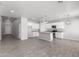 Open concept kitchen with white cabinets, granite countertops, and stainless steel appliances at 9290 W Troy Dr, Arizona City, AZ 85123
