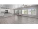 Open concept kitchen with white cabinets, granite countertops, and stainless steel appliances at 9290 W Troy Dr, Arizona City, AZ 85123