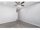 Well-lit bedroom with ceiling fan and carpet at 9290 W Troy Dr, Arizona City, AZ 85123