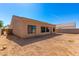 Desert lot with new home and block wall at 9290 W Troy Dr, Arizona City, AZ 85123