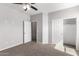 Bright bedroom with ceiling fan and closet at 9290 W Troy Dr, Arizona City, AZ 85123