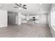 Open concept kitchen with white cabinets, granite countertops, and stainless steel appliances at 9290 W Troy Dr, Arizona City, AZ 85123