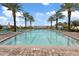 Inviting community pool with lounge chairs and palm trees at 5725 S 101St St, Mesa, AZ 85212