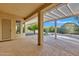 Covered patio with pergola and desert landscaping at 42929 W Castle Cove Cir, Maricopa, AZ 85138