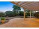 Covered patio with pergola, offering relaxing views at 42929 W Castle Cove Cir, Maricopa, AZ 85138
