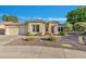 One-story house with a two-car garage and desert landscaping at 42929 W Castle Cove Cir, Maricopa, AZ 85138