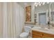 Clean bathroom with a shower/tub combo, toilet, and vanity at 42929 W Castle Cove Cir, Maricopa, AZ 85138