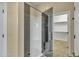 Bathroom with a walk-in shower and built-in bench at 42929 W Castle Cove Cir, Maricopa, AZ 85138