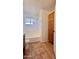 Updated bathroom with tub, tile floor and built-in storage at 4502 W Crittenden Ln, Phoenix, AZ 85031