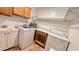 Laundry room with washer, dryer, cabinets and a utility sink at 4502 W Crittenden Ln, Phoenix, AZ 85031