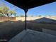 Large backyard with covered patio and gravel area at 4502 W Crittenden Ln, Phoenix, AZ 85031