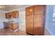 Kitchen with wood cabinets, tile floor and stainless steel appliances at 4502 W Crittenden Ln, Phoenix, AZ 85031