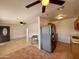 Open living room and kitchen area with tile floors at 4502 W Crittenden Ln, Phoenix, AZ 85031