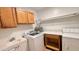 Laundry room with washer, dryer, cabinets and a utility sink at 4502 W Crittenden Ln, Phoenix, AZ 85031