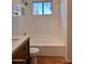 Clean bathroom with a bathtub and updated vanity at 4502 W Crittenden Ln, Phoenix, AZ 85031