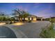 House exterior with landscaping and driveway at dusk at 10764 N 138Th Way, Scottsdale, AZ 85259