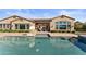 Single-story home with a large pool, patio, and basketball hoop at 10764 N 138Th Way, Scottsdale, AZ 85259