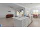 Kitchen with island, sink, and view into living room at 22207 N Daniel Dr, Maricopa, AZ 85138