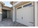 Two-car garage with white door and black hardware at 22207 N Daniel Dr, Maricopa, AZ 85138