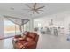 Open concept living room and kitchen with island at 22207 N Daniel Dr, Maricopa, AZ 85138