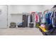 Large walk-in closet with ample shelving and hanging space at 22207 N Daniel Dr, Maricopa, AZ 85138