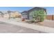 House exterior with gray siding and paver driveway at 22207 N Daniel Dr, Maricopa, AZ 85138