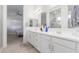 Elegant bathroom with double sinks and a large mirror at 22207 N Daniel Dr, Maricopa, AZ 85138