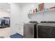 Laundry room with washer, dryer, and shelving at 22207 N Daniel Dr, Maricopa, AZ 85138