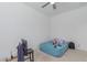 Simple bedroom with a bed and small workspace at 22207 N Daniel Dr, Maricopa, AZ 85138