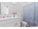 Clean bathroom with white vanity, shower, and toilet at 22207 N Daniel Dr, Maricopa, AZ 85138