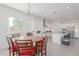 Kitchen with round dining table and white cabinets at 22207 N Daniel Dr, Maricopa, AZ 85138