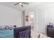 Bright bedroom with a double bed, TV, and access to a bathroom at 22207 N Daniel Dr, Maricopa, AZ 85138