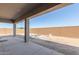 Covered patio, partially fenced backyard, and pool at 22207 N Daniel Dr, Maricopa, AZ 85138