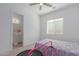 Bedroom with a bed, mini trampoline, and access to bathroom at 22207 N Daniel Dr, Maricopa, AZ 85138