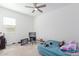 Cozy bedroom with a bed and gaming setup at 22207 N Daniel Dr, Maricopa, AZ 85138