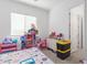 bedroom with a bed, toys, and dresser at 22207 N Daniel Dr, Maricopa, AZ 85138