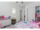 bedroom with a bed, toys, and closet at 22207 N Daniel Dr, Maricopa, AZ 85138